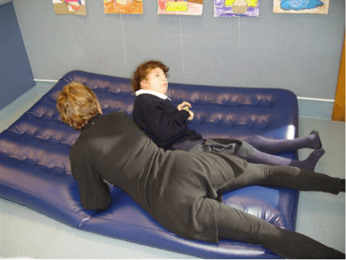 Sam and the O &amp;amp; M Specialist are lying on the airbed.